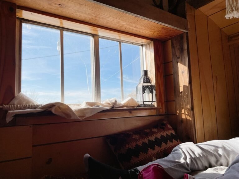Blue sky through a window inside the camping car